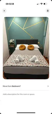 a bedroom with a bed with two slippers on it at incanto e campo de fiori in Rome