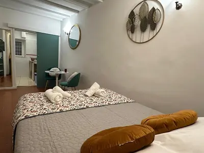 a bedroom with a bed with white pillows on it at incanto e campo de fiori in Rome