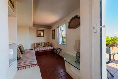 a living room with a couch and a window at The Perfect View- Angel's Castle' in Rome