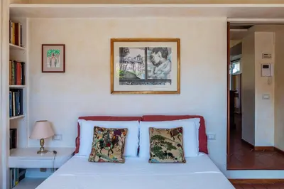 a bedroom with a bed with two pillows at The Perfect View- Angel's Castle' in Rome