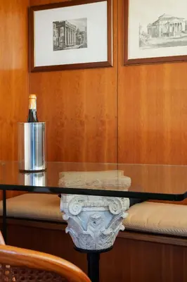 a glass table with a bottle of wine on top of it at The Perfect View- Angel's Castle' in Rome
