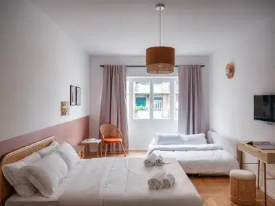 a living room with two beds and a couch at Zen Trastevere Luxury Room - Zen 54 in Rome