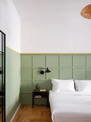 a bedroom with two beds and a side table at Zen Trastevere Luxury Room - Zen 54 in Rome