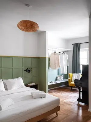 a bedroom with a bed and a desk and a chair at Zen Trastevere Luxury Room - Zen 54 in Rome