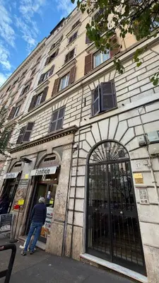 a man standing in front of a building at AliHouse Apartment in Rome
