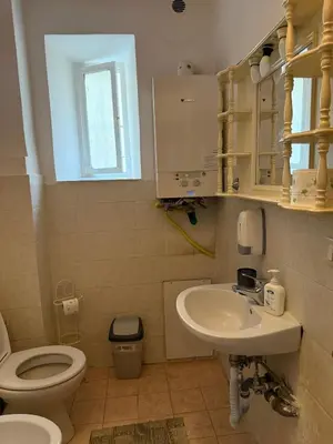 a small bathroom with a toilet and a sink at Roma Belvedere Termini in Rome