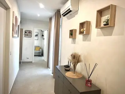 a hallway of a home with a table with a plant on it at Oasi di pace in Rome
