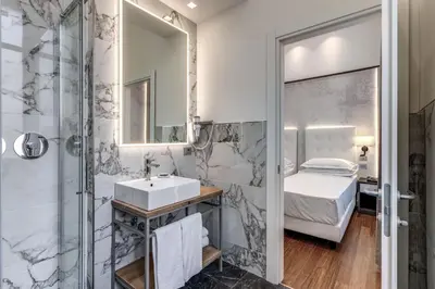 a bathroom with a sink and a shower at The Spotlight Boutique Hotel in Rome