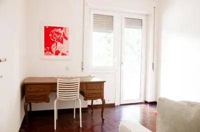 an office with a desk and a chair and a window at Dolcevita suite in Rome