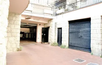 a pair of garage doors on a building at Dolcevita suite in Rome