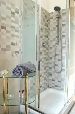 a bathroom with a tub and a glass shower at Annmarie House, Vaticano - Cipro in Rome