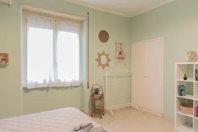 a bedroom with a bed and a window at Annmarie House, Vaticano - Cipro in Rome