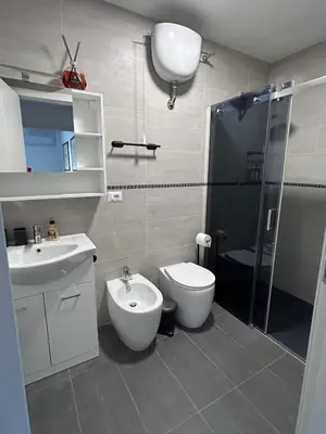 a bathroom with a toilet and a sink and a shower at Sweet Home Fleming in Rome