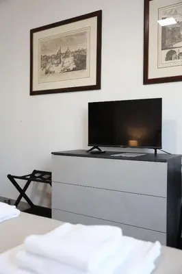 a living room with a tv on a dresser at Sweet Home Fleming in Rome