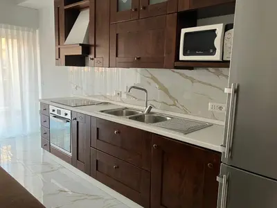 a kitchen with a sink and a microwave at Domus4U in Rome