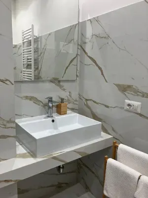 a bathroom with a white sink and a mirror at Domus4U in Rome