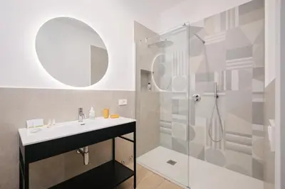 a bathroom with a sink and a shower at Pop Domus Guest House o Affittacamere in Rome