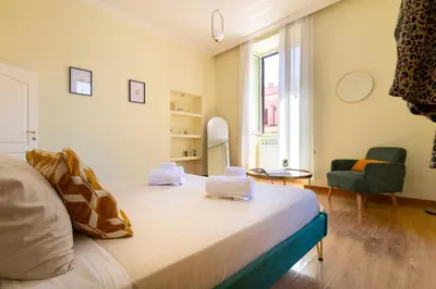 a bedroom with a bed with two towels on it at Candia Retreat in Rome