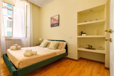 a bedroom with a bed with towels on it at Candia Retreat in Rome