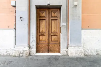a wooden door on the side of a building at Candia Retreat in Rome