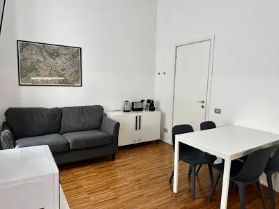 a living room with a couch and a table at La Casabella Rome Center in Rome