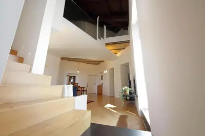 an open hallway with stairs and a dining room at YCH-Splendido attico con terrazzo a San Giovanni in Rome