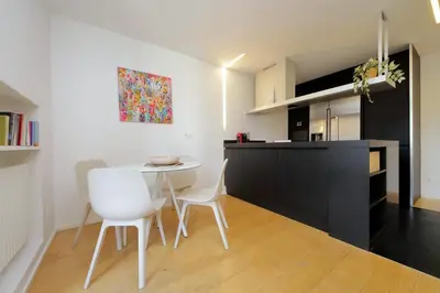 a kitchen and dining room with a table and chairs at YCH-Splendido attico con terrazzo a San Giovanni in Rome