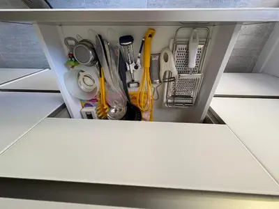 a drawer filled with kitchen utensils at La Casa di Valentina in Rome