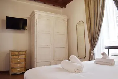 a bedroom with two beds with white towels on them at Apartment in Campo de' Fiori in Rome