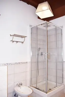 a bathroom with a shower with a toilet and a sink at Apartment in Campo de' Fiori in Rome