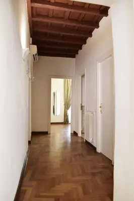 an empty hallway with white walls and a wooden ceiling at Apartment in Campo de' Fiori in Rome