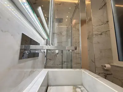 a bathroom with a bath tub and a sink at Luxe roma in Rome