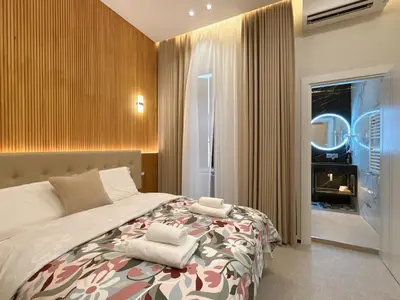 a bedroom with a bed with two towels on it at Luxe roma in Rome