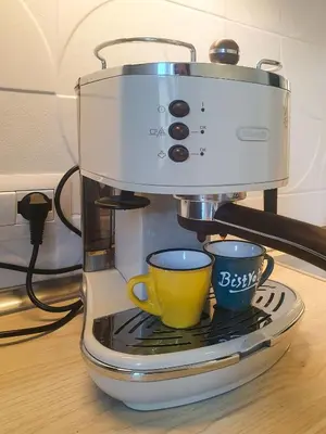 a coffee maker with two cups on a table at Quiet, Cozy flat near citycenter in Rome