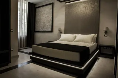 a bedroom with a large bed in a room at Campo De’ Fiori Prestige Rooms in Rome