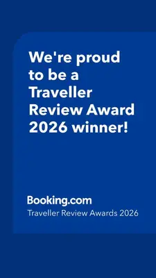 a blue sign that says were proud to be a traveller reviewagency winner at Campo De’ Fiori Prestige Rooms in Rome