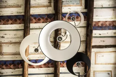two mirrors hanging on a wall in a room at Campo De’ Fiori Prestige Rooms in Rome