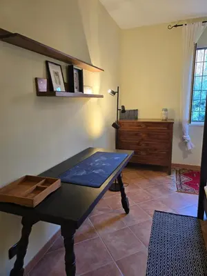 a living room with a table and a wooden table at Hortus in Rome