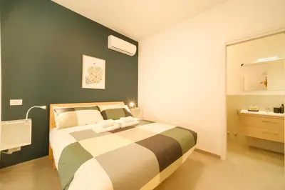 a bedroom with a bed and a sink in it at Domus Paruta in Rome