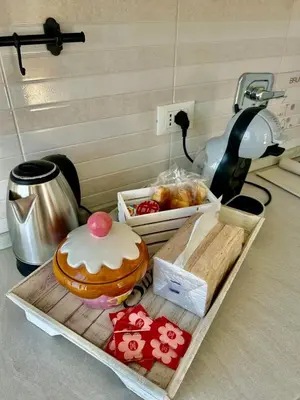 a table with a tray with a pastry and a box of pastries at La casa di Roby in Rome