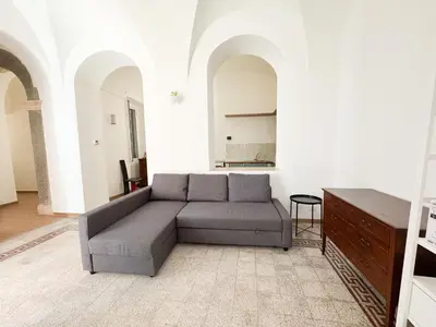 a living room with a couch and a table at Sant'Onofrio Boutique Apartment in Rome