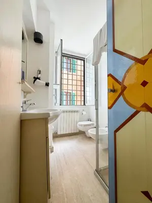 a bathroom with a sink and a toilet at Sant'Onofrio Boutique Apartment in Rome