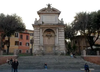 a building with a monument in the middle of some stairs at House of Marzia #6000rome in Rome