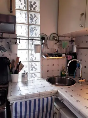 a kitchen with a sink and a window at House of Marzia #6000rome in Rome