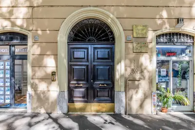 a building with a large wooden door on it at Sophia B&B 94 Trastevere in Rome