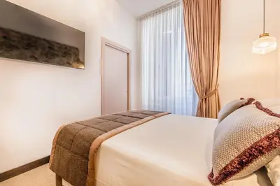 a bedroom with a bed and a window at Sophia B&B 94 Trastevere in Rome