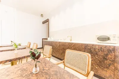a dining room with tables and chairs and a counter at Sophia B&B 94 Trastevere in Rome