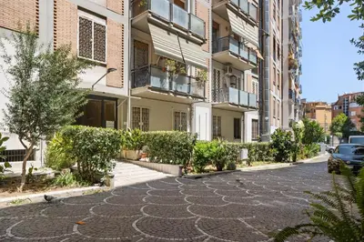 a cobblestone street in an apartment building at Betti Classic Home in Rome