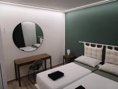 a bedroom with a bed and a mirror on the wall at Urbanflat Termini in Rome