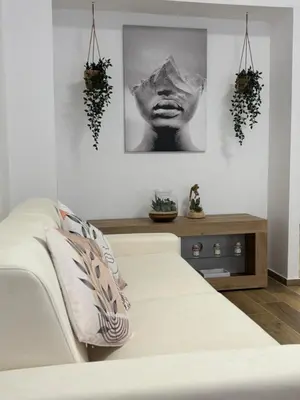 a bedroom with a bed and a picture of a woman at Domus Gregorio VII in Rome